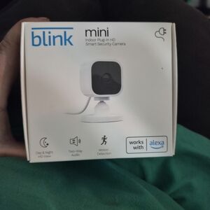 Blink Mini Compact Indoor Plug-in Smart Security Camera. 